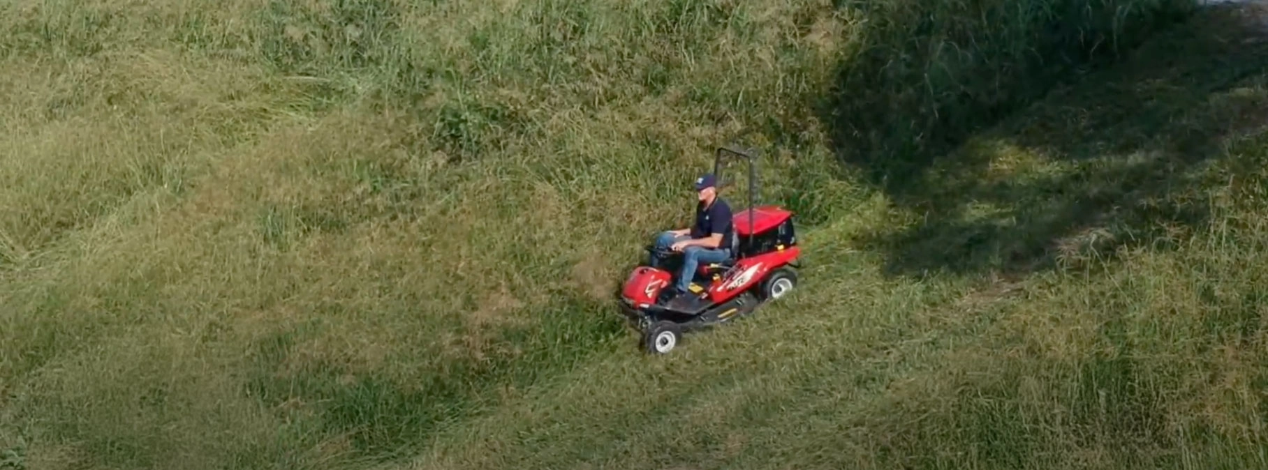 photo of man mowing